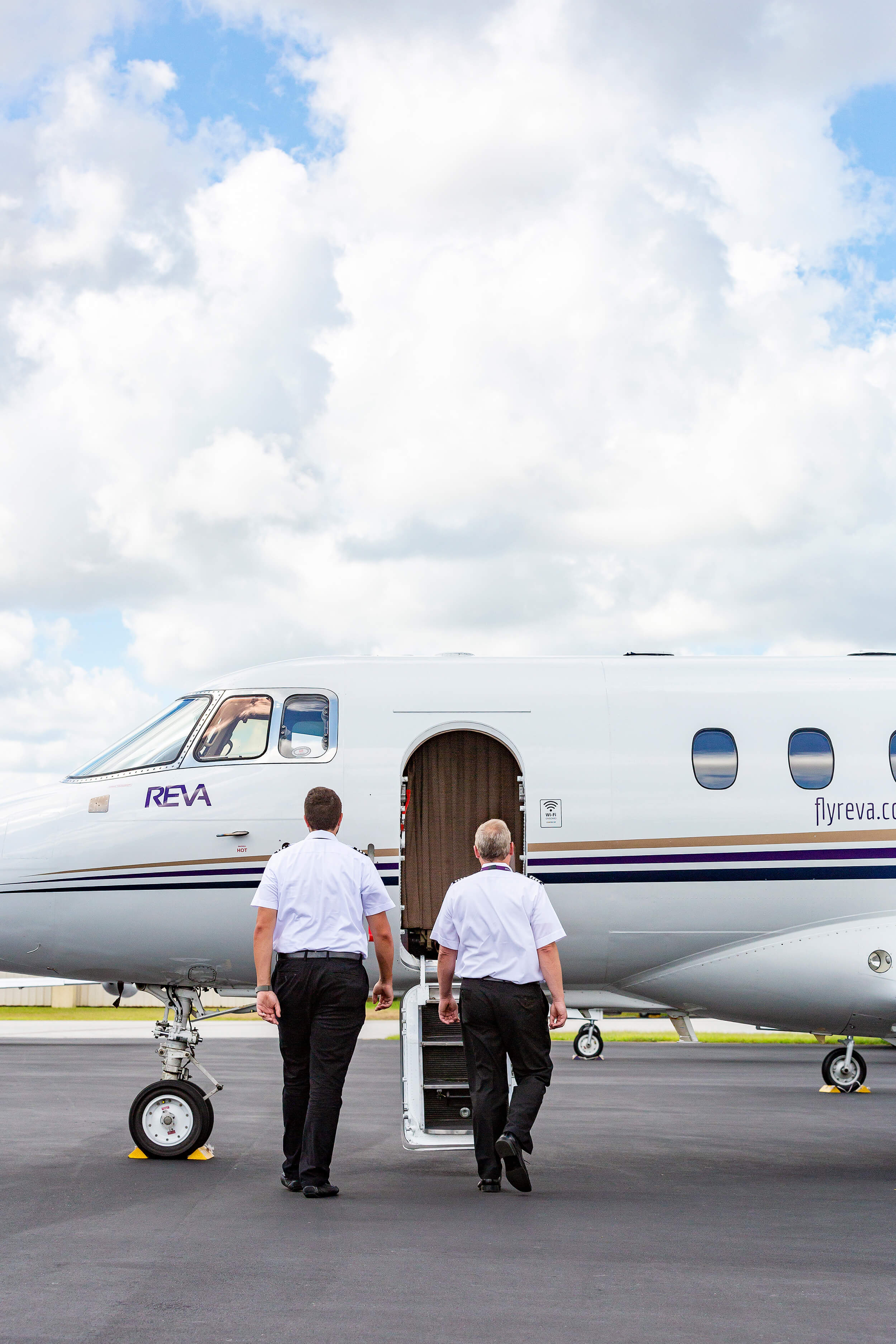 Two Pilots Walk Towards A United States Air Ambulance Services Plane